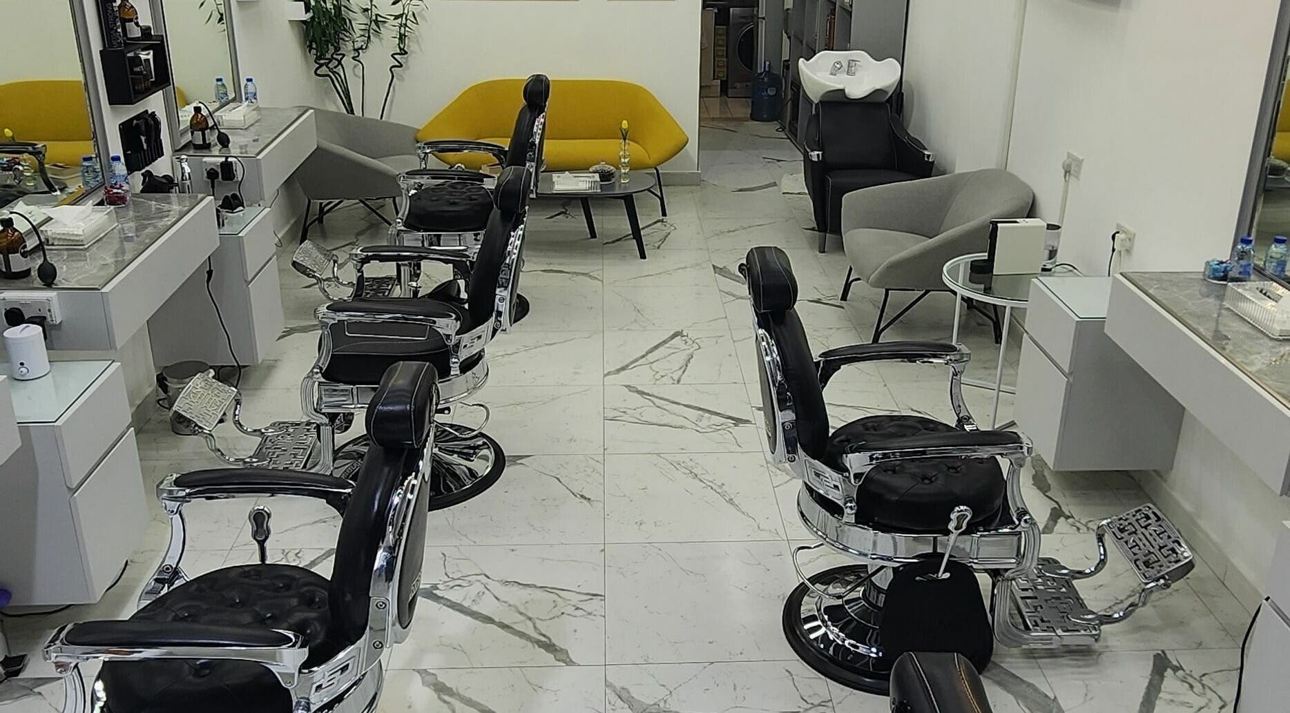 Interior of Movember Gents Salon in Dubai, AE, featuring modern barber chairs and sleek design.