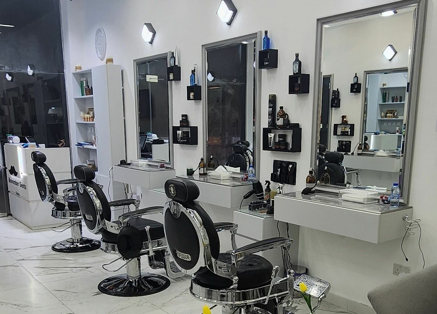 Sleek interior of Movember Gents Salon in Dubai, AE featuring modern barber chairs and styling stations.