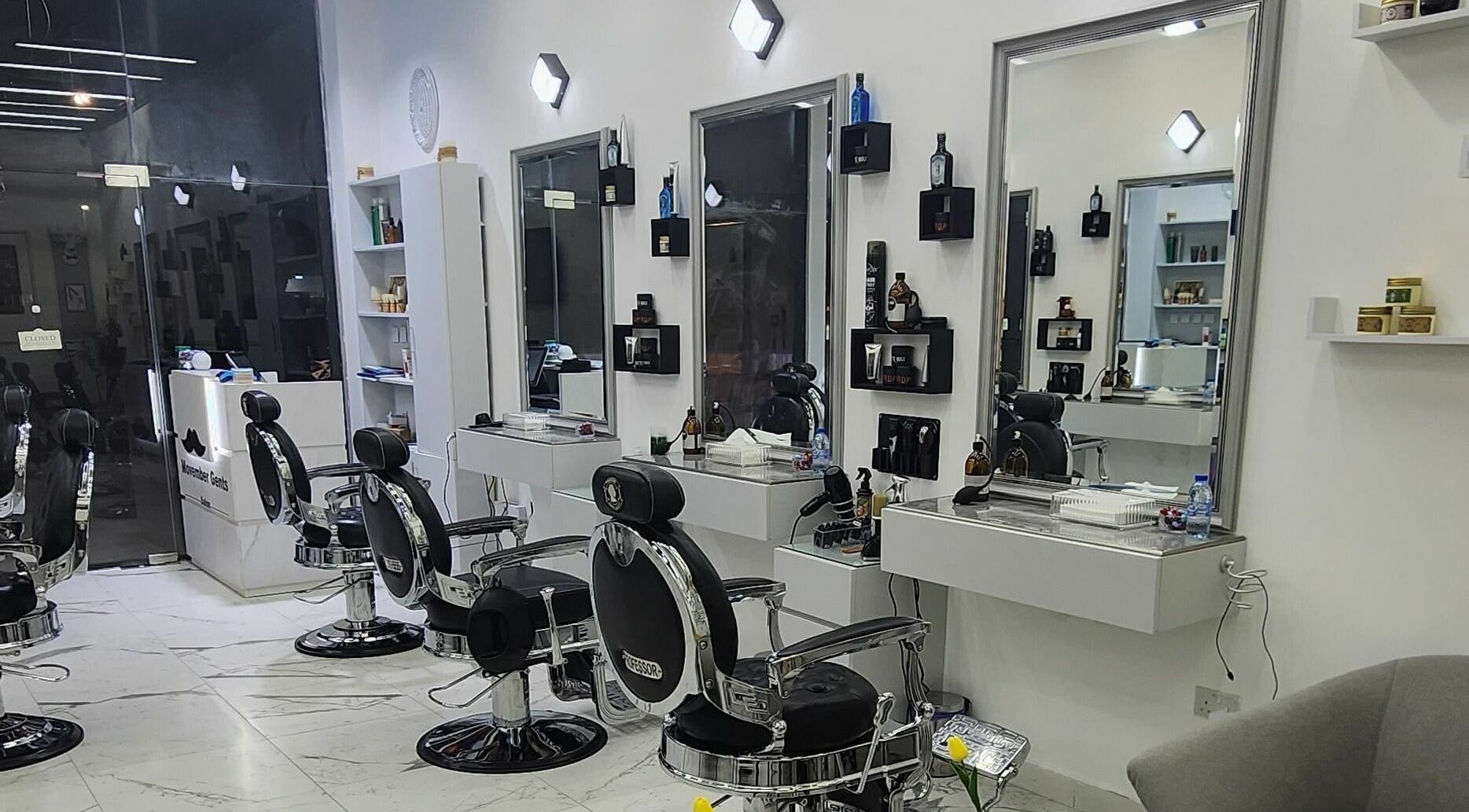 Sleek interior of Movember Gents Salon in Dubai, AE featuring modern barber chairs and styling stations.