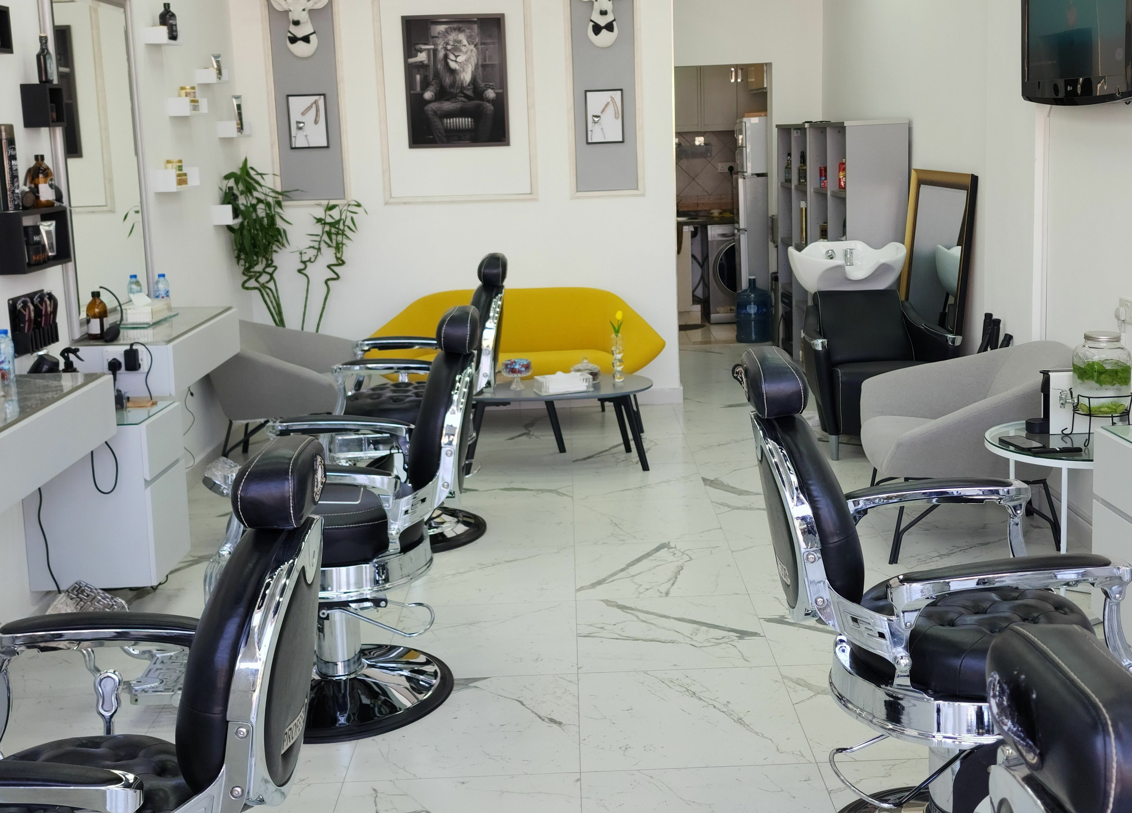 Elegant interior of Movember Gents Salon in Dubai, AE, showcasing sleek barber chairs and stylish decor.