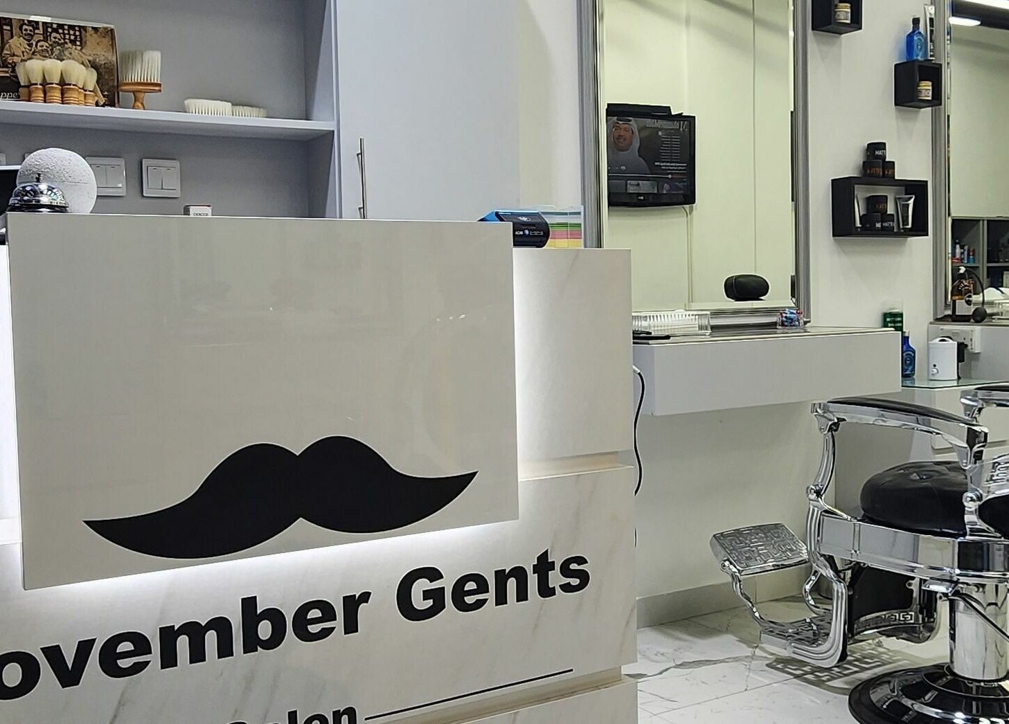 Interior of Movember Gents Salon in Dubai, AE, showcasing a sleek barber chair and stylish decor.