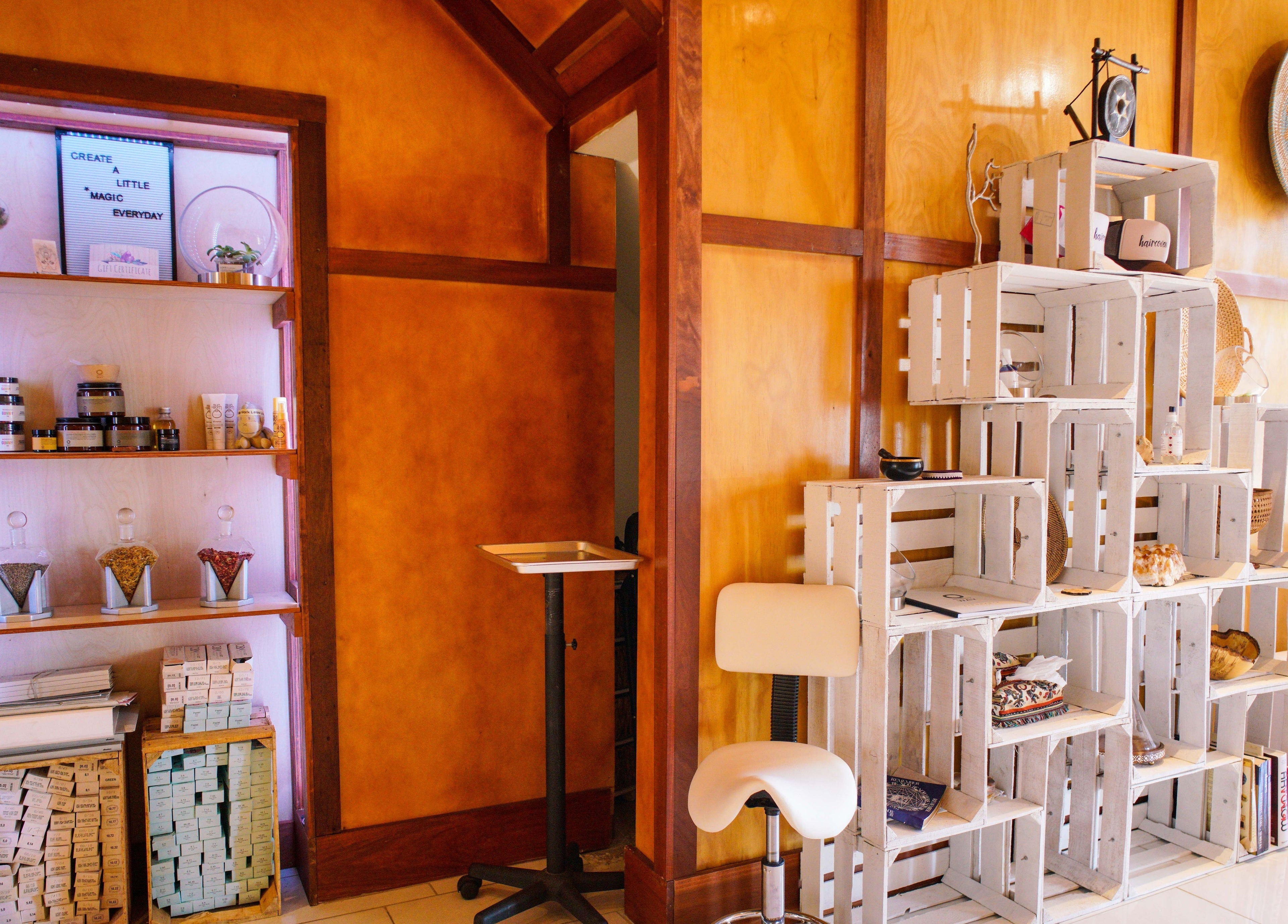 Stylish product display at Haircoven, Los Angeles, California, US with natural decor and wellness items.