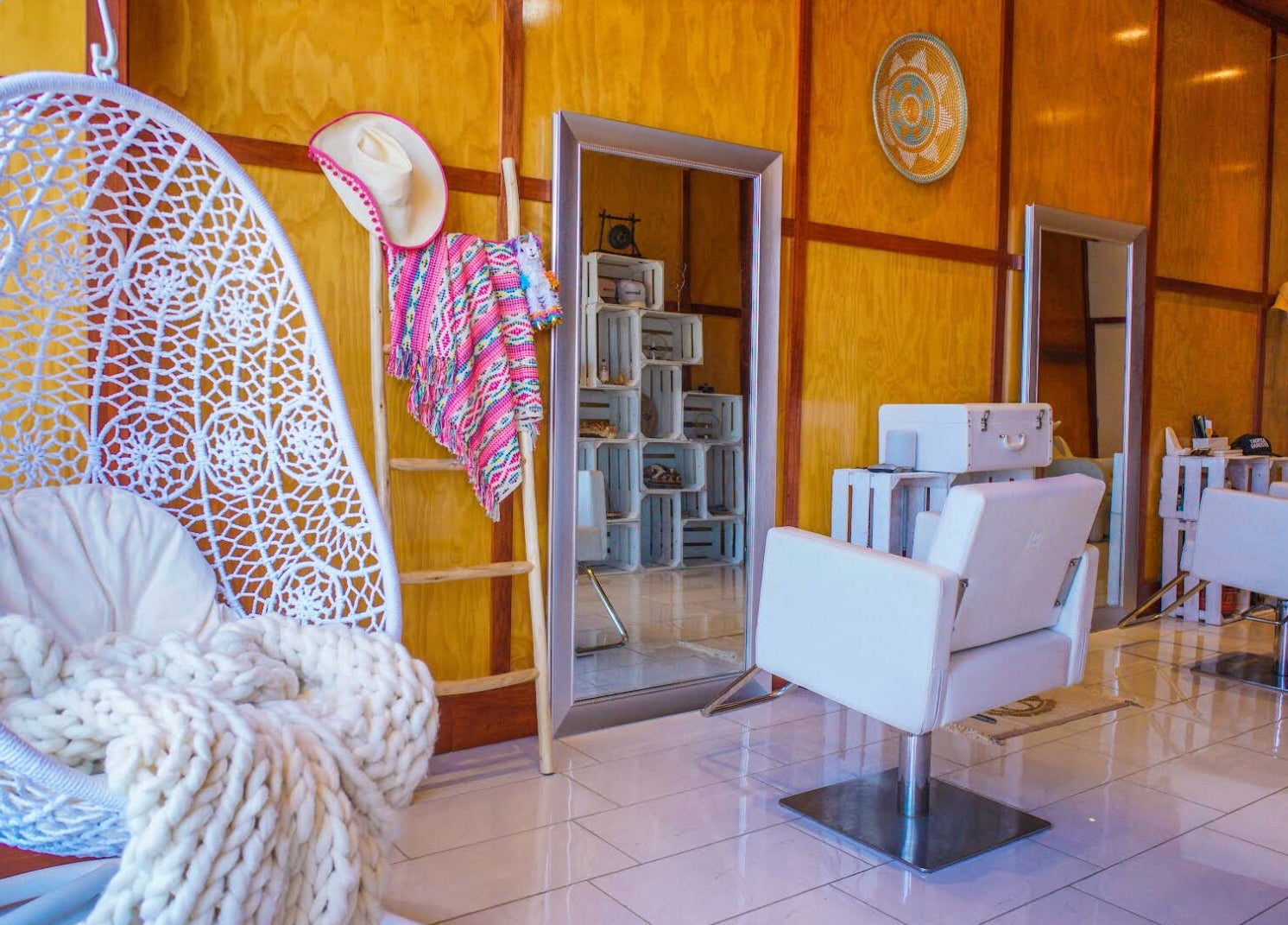 Elegant salon interior at Haircoven, Los Angeles, California with modern decor and cozy seating.