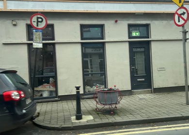 Street view of Mi Amor Clinic Kilmallock, County Limerick, IE, with modern exterior and sidewalk details.