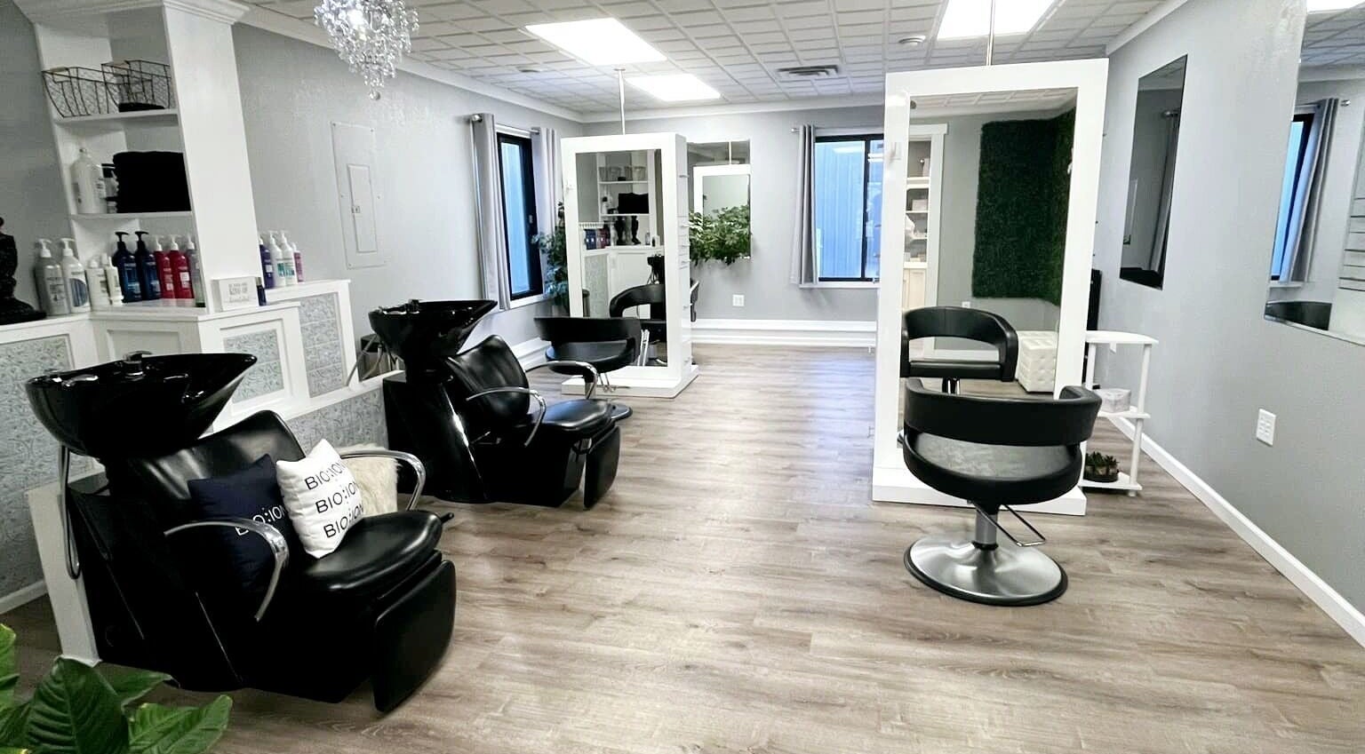Interior of Shear Bliss salon in Tomah, Wisconsin, showcasing modern styling chairs and wash stations.