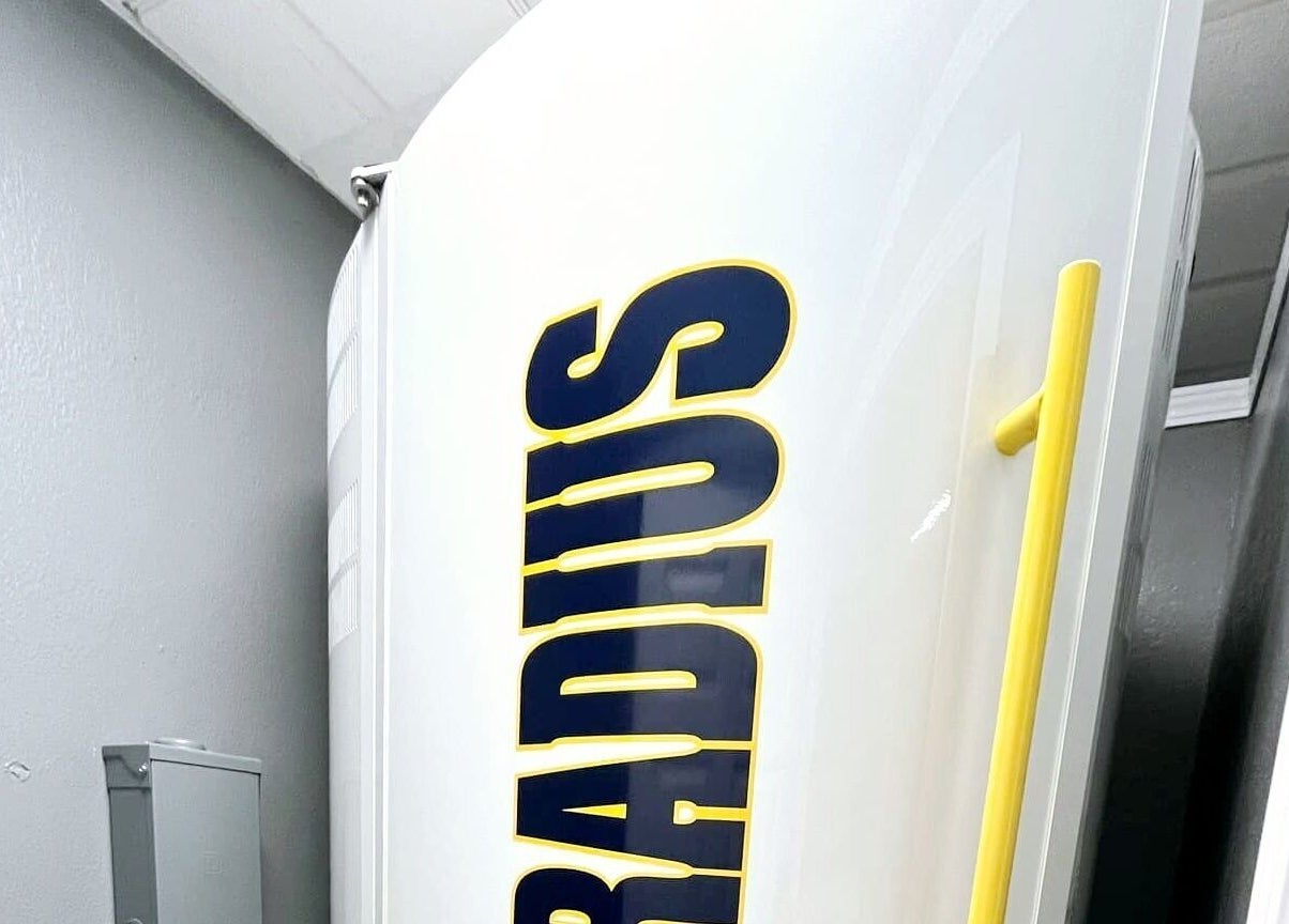 Radius tanning booth at Indoor Beach, Tomah, Wisconsin, US, offering advanced sunless tanning solutions.
