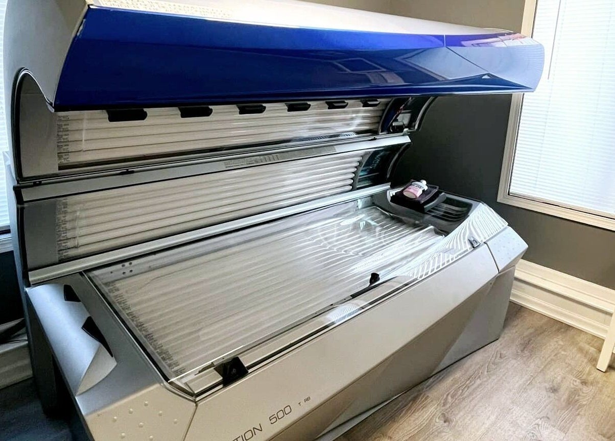 A modern tanning bed at Indoor Beach in Tomah, Wisconsin, US, situated in a serene room.