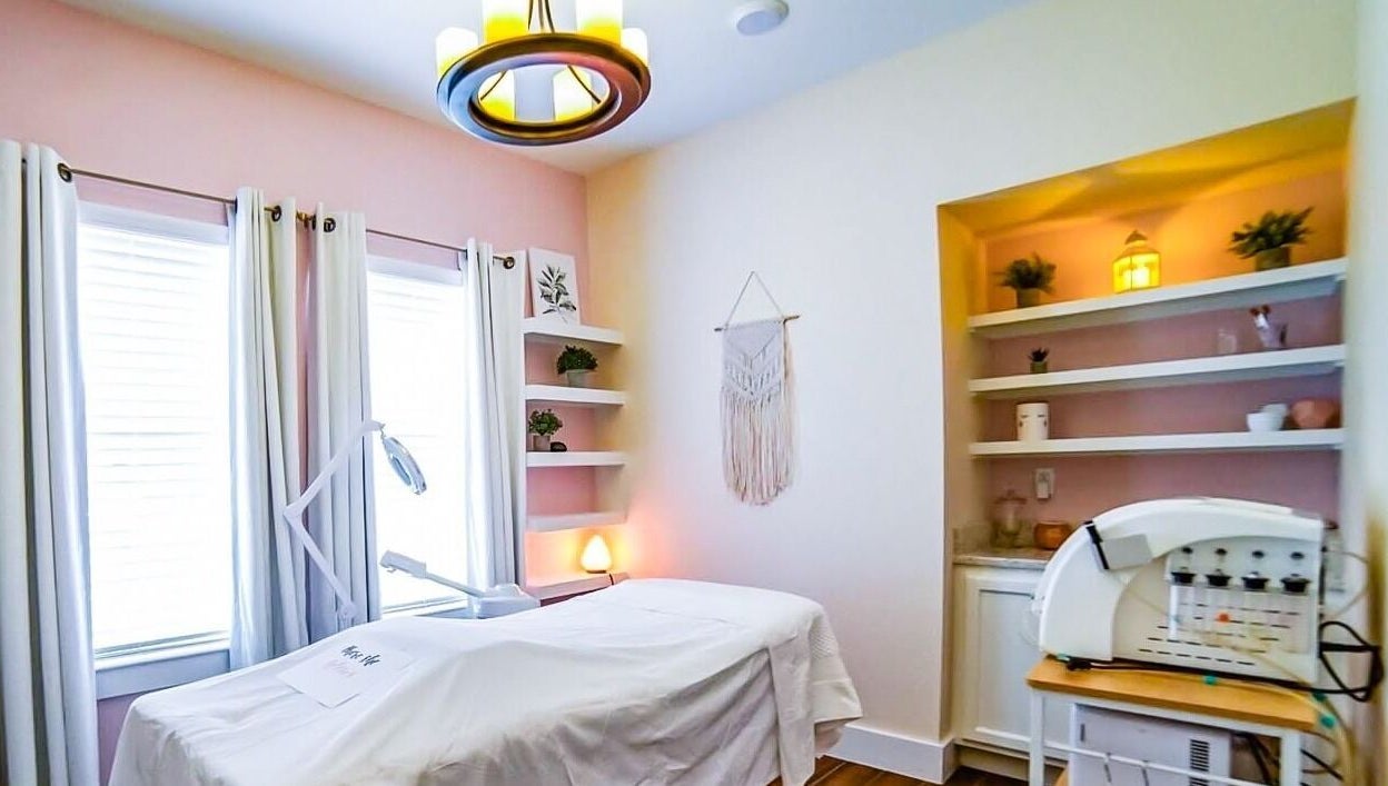 Relaxing therapy room at Energe Spa in Cypress, Texas, US, with soft lighting and soothing decor.