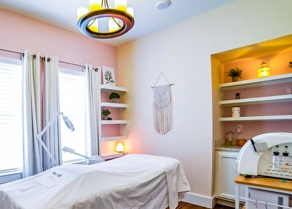 Relaxing therapy room at Energe Spa in Cypress, Texas, US, with soft lighting and soothing decor.