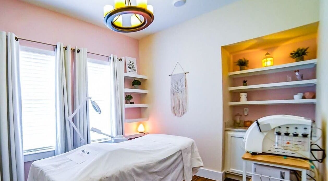 Relaxing therapy room at Energe Spa in Cypress, Texas, US, with soft lighting and soothing decor.