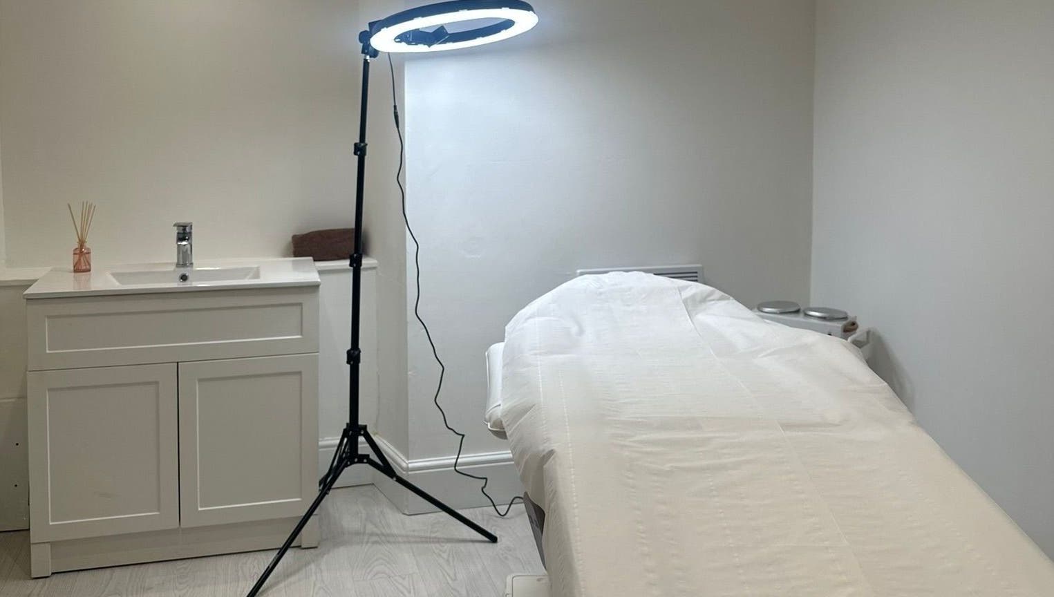 A serene treatment room at Rachael Louise & Co, previously Tan Oz, in Glasgow, Scotland, GB with a massage bed.