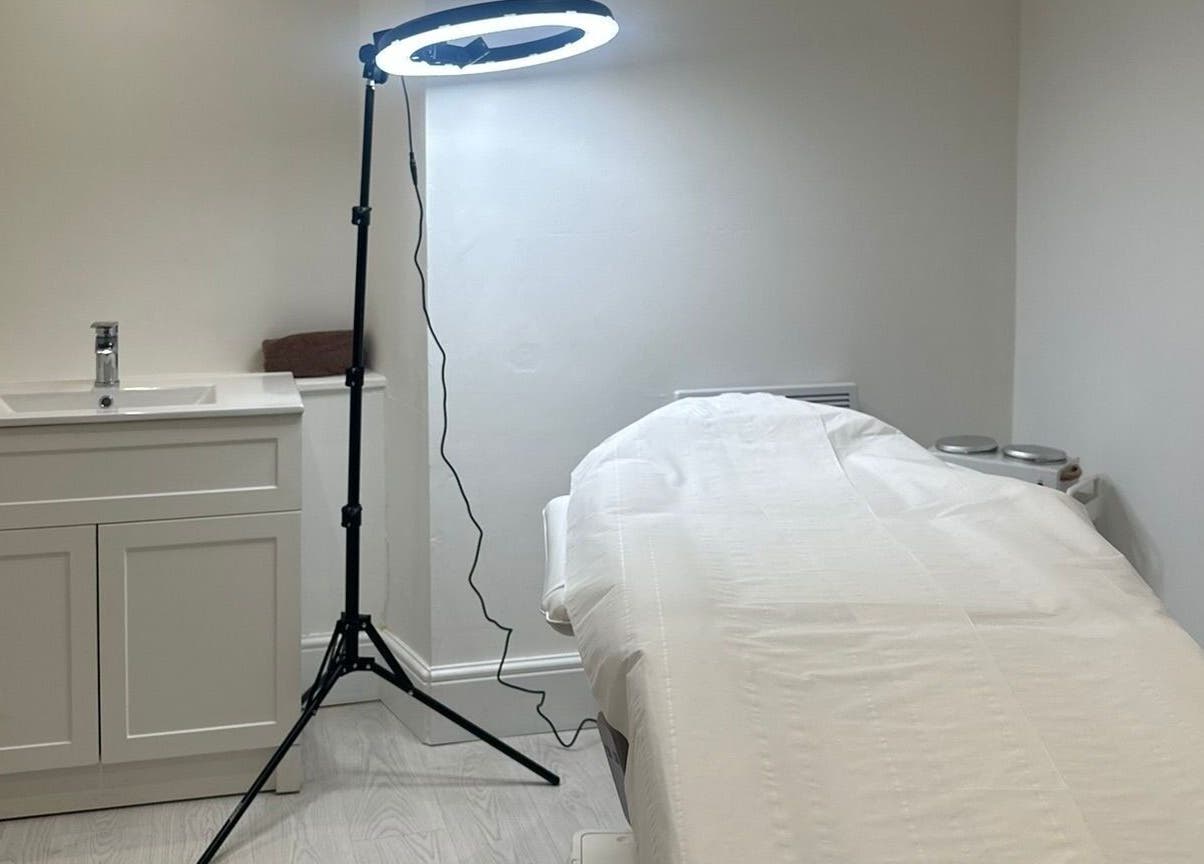 A serene treatment room at Rachael Louise & Co, previously Tan Oz, in Glasgow, Scotland, GB with a massage bed.