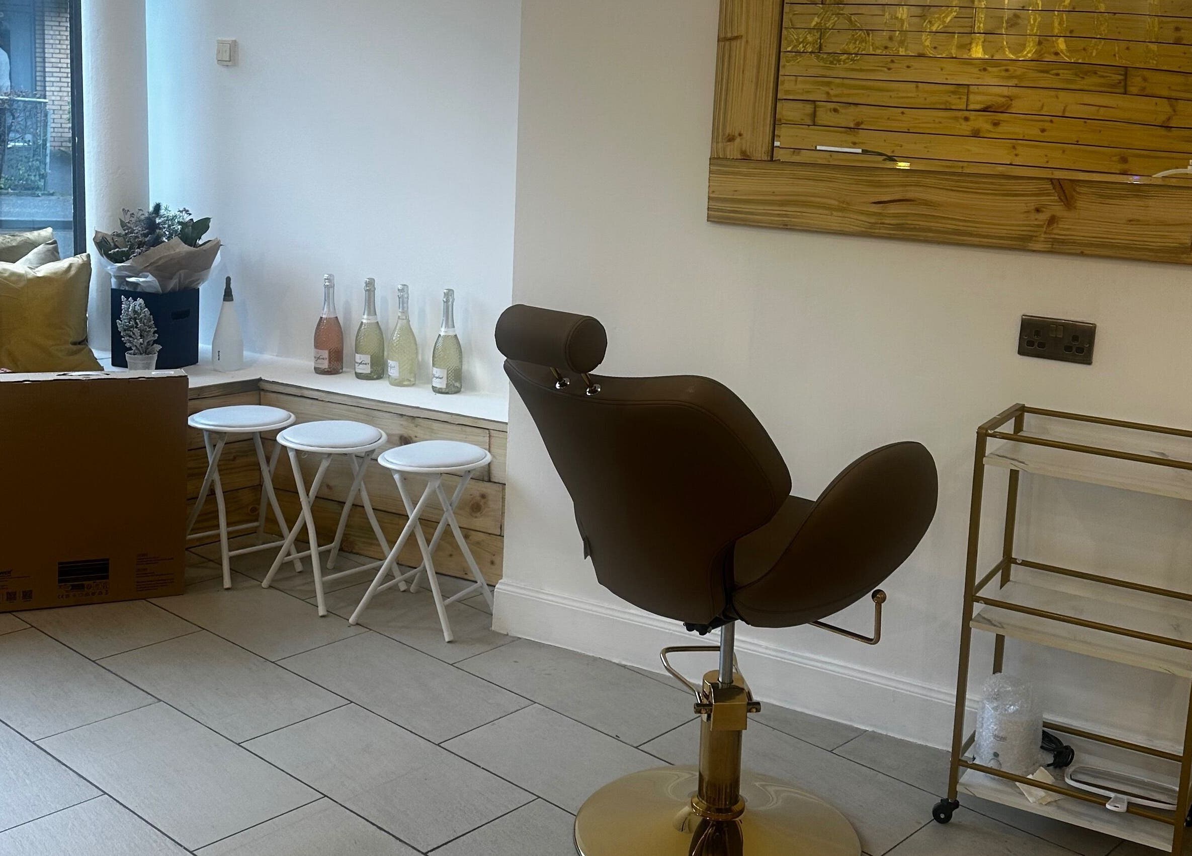 Modern seating area at Rachael Louise & Co (previously Tan Oz), Glasgow, Scotland, GB, with stylish decor.