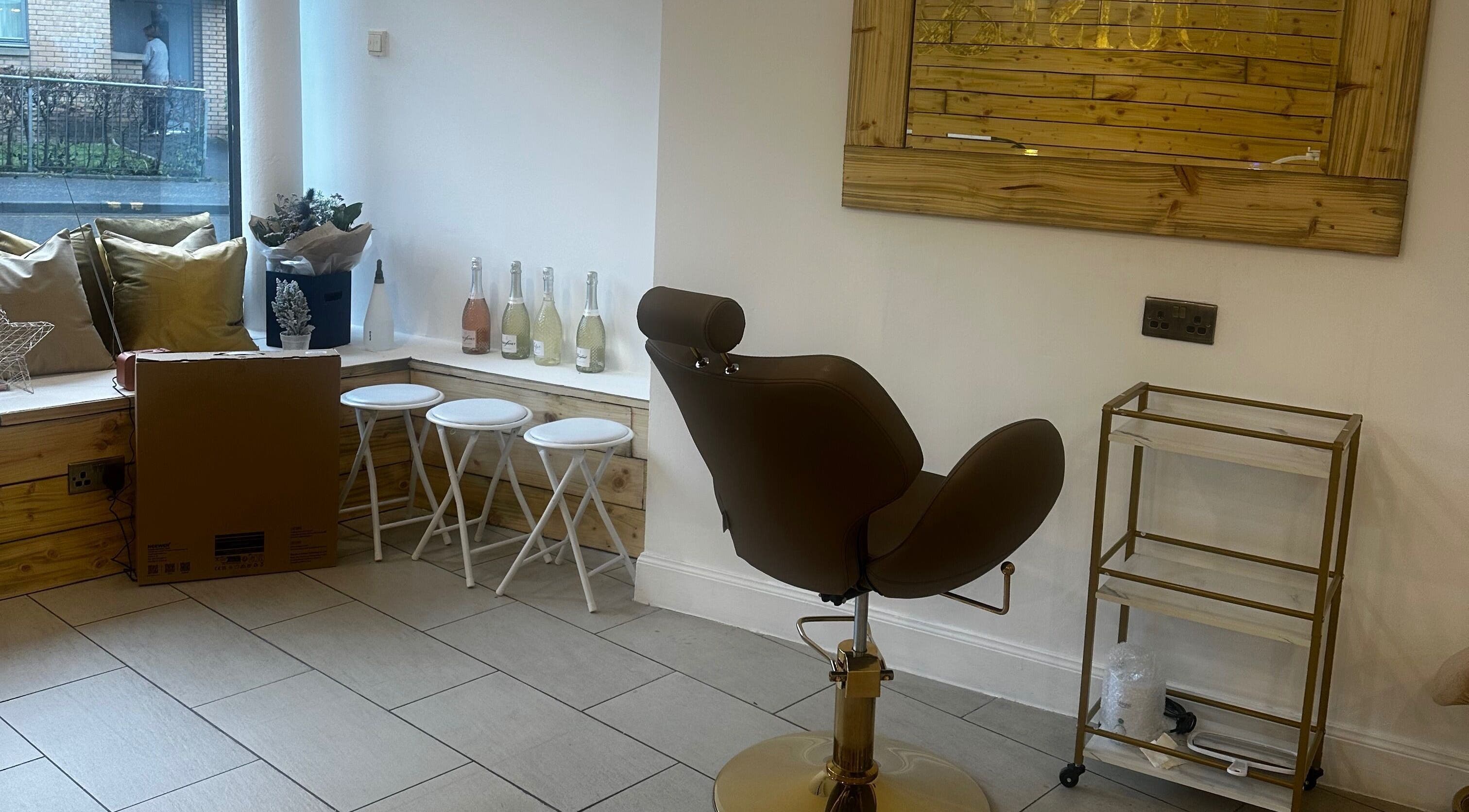 Modern seating area at Rachael Louise & Co (previously Tan Oz), Glasgow, Scotland, GB, with stylish decor.