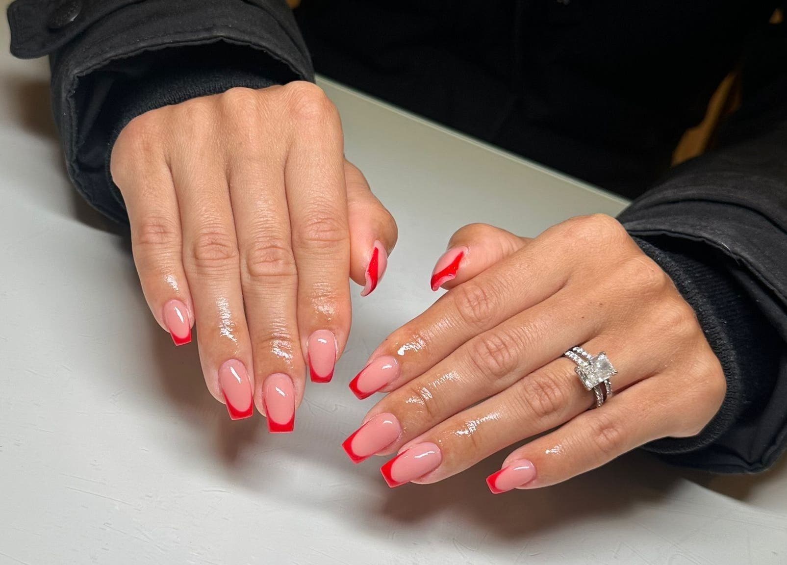 Elegant red-tipped nails at Rachael Louise & Co (previously Tan Oz), Glasgow, Scotland, GB. Stylish nail art.