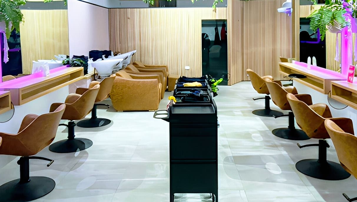 Modern salon interior at XO HAIR CO., Melbourne, Victoria, AU with sleek chairs and vibrant decor.