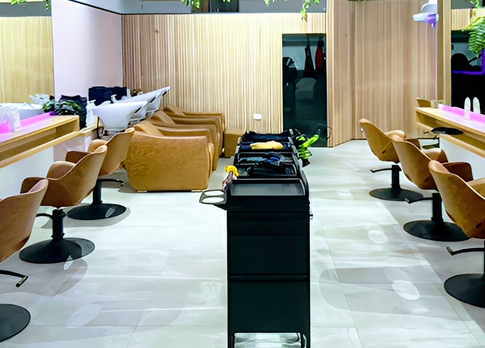 Modern salon interior at XO HAIR CO., Melbourne, Victoria, AU with sleek chairs and vibrant decor.