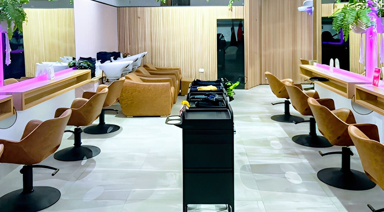 Modern salon interior at XO HAIR CO., Melbourne, Victoria, AU with sleek chairs and vibrant decor.