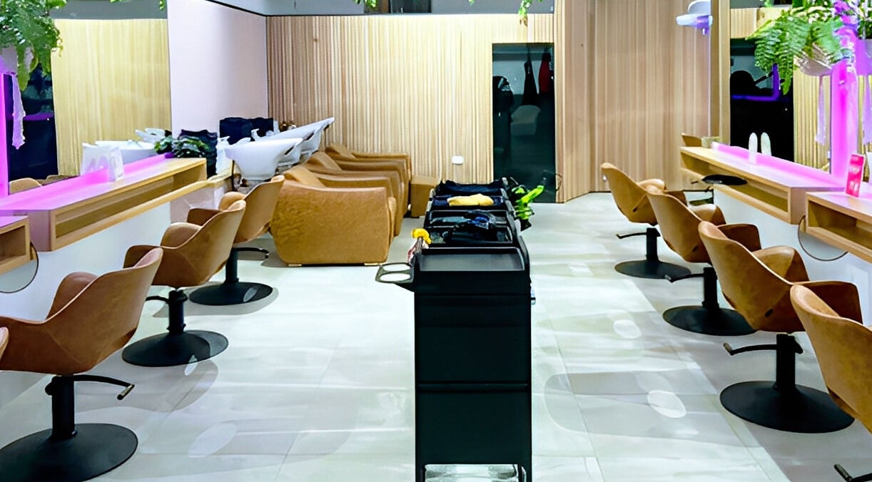 Modern salon interior at XO HAIR CO., Melbourne, Victoria, AU with sleek chairs and vibrant decor.