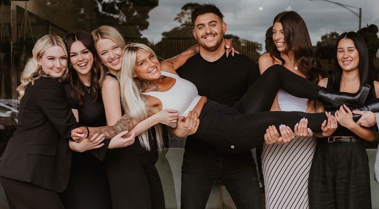 Happy team at XO HAIR CO., Melbourne, Victoria, AU, celebrating together.