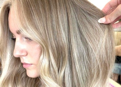 Blonde hair with radiant highlights at XO HAIR CO., Melbourne, Victoria, AU, showcasing expert styling.
