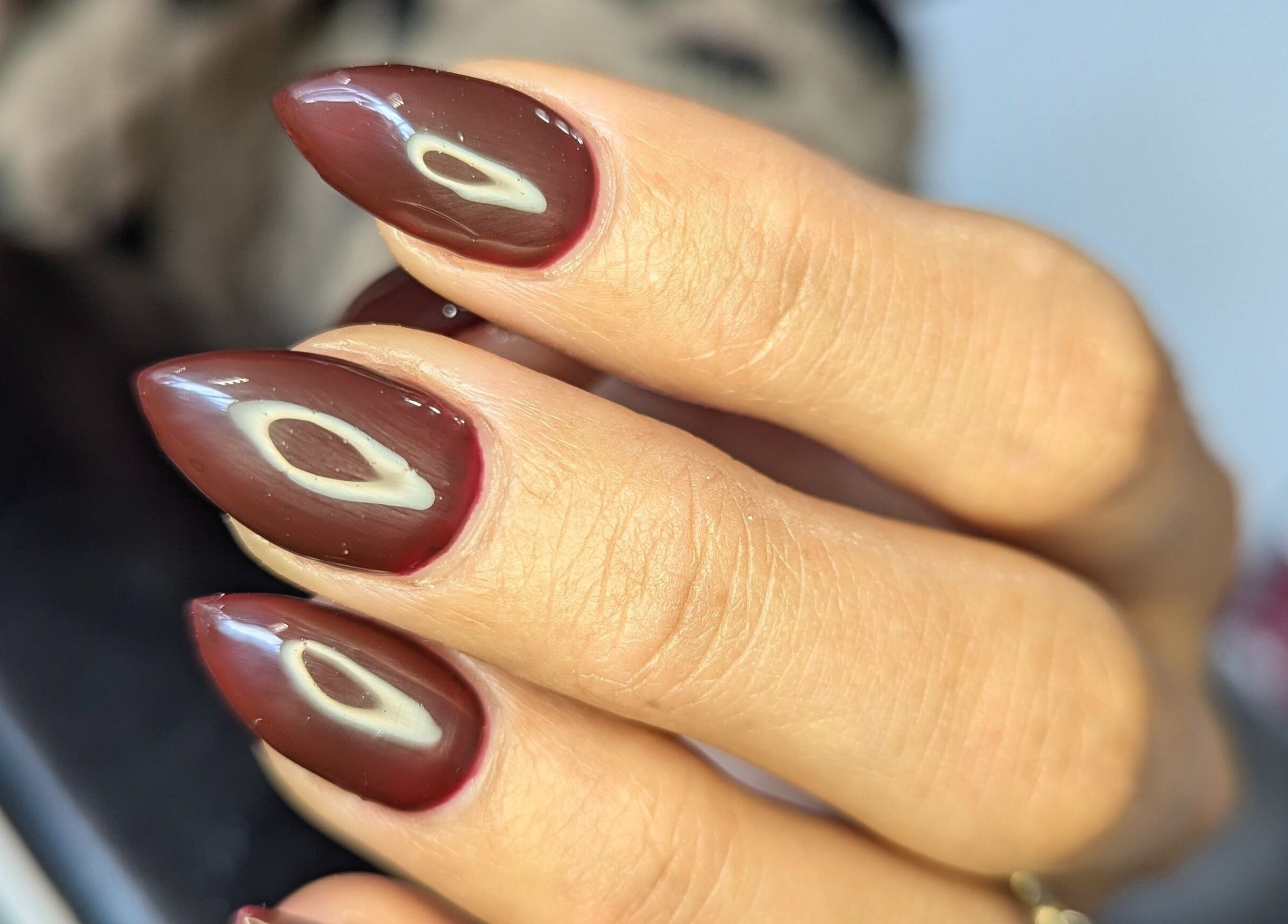 Stunning maroon nails with unique art at Kathsklaws, Wolverhampton, England, GB.