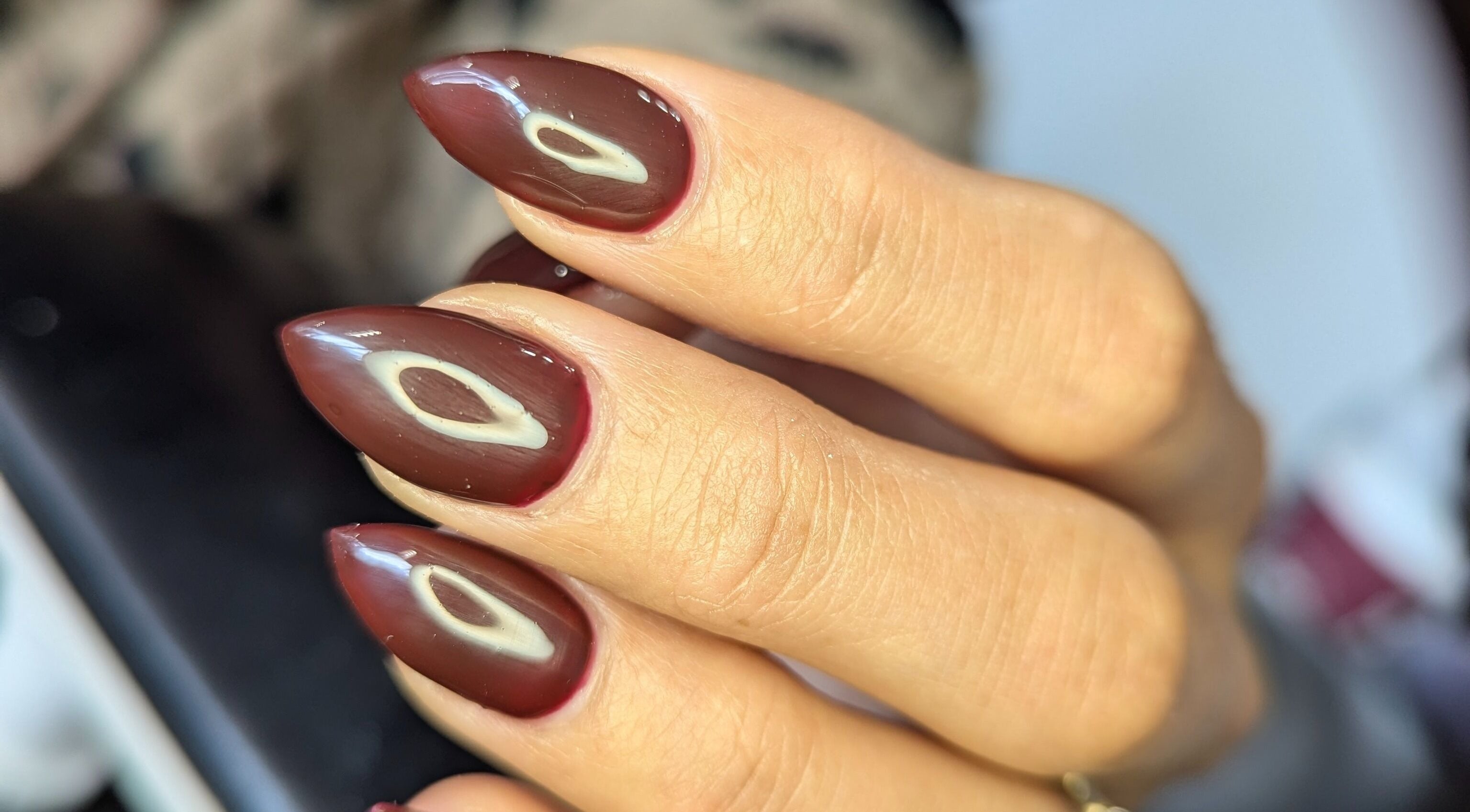Stunning maroon nails with unique art at Kathsklaws, Wolverhampton, England, GB.