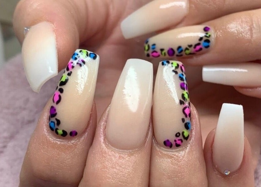 Stylish nail art with leopard print design at Kathsklaws, Wolverhampton, England, GB.