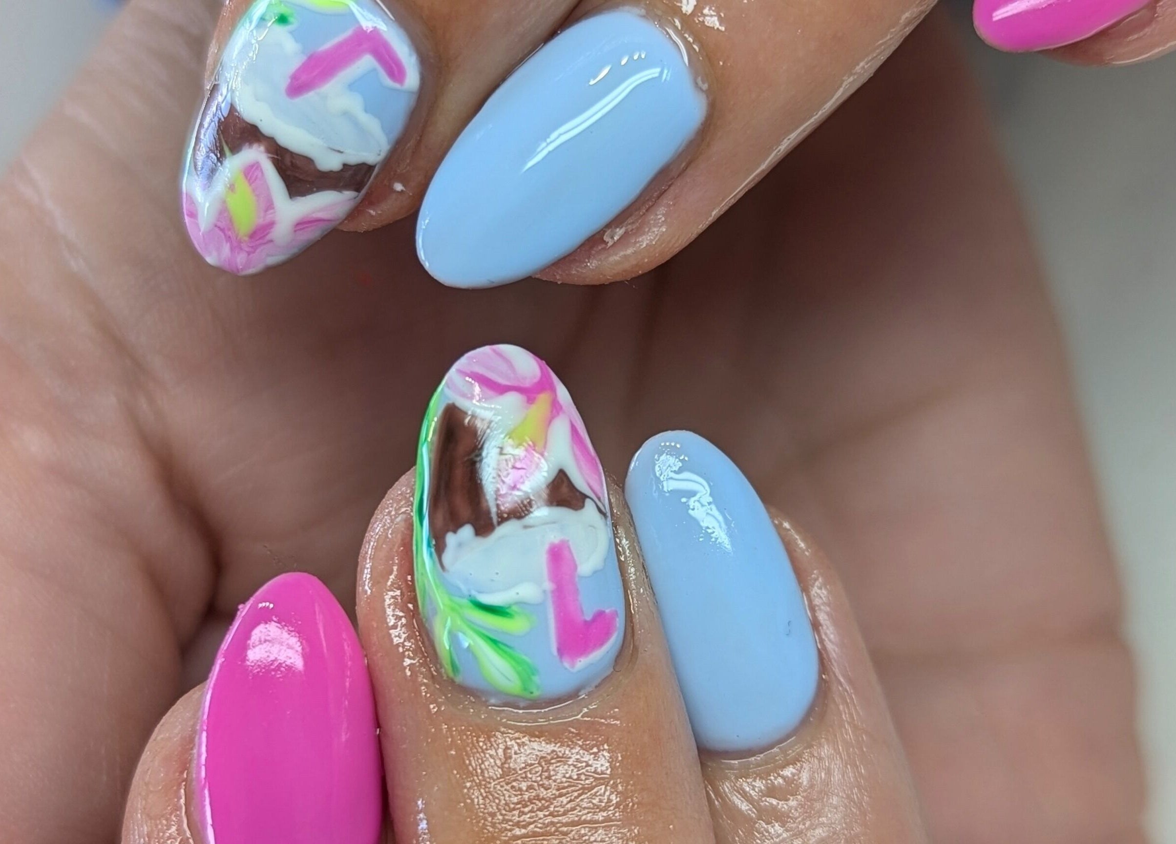 Colorful nail art with floral designs at Kathsklaws, Wolverhampton, England, GB.