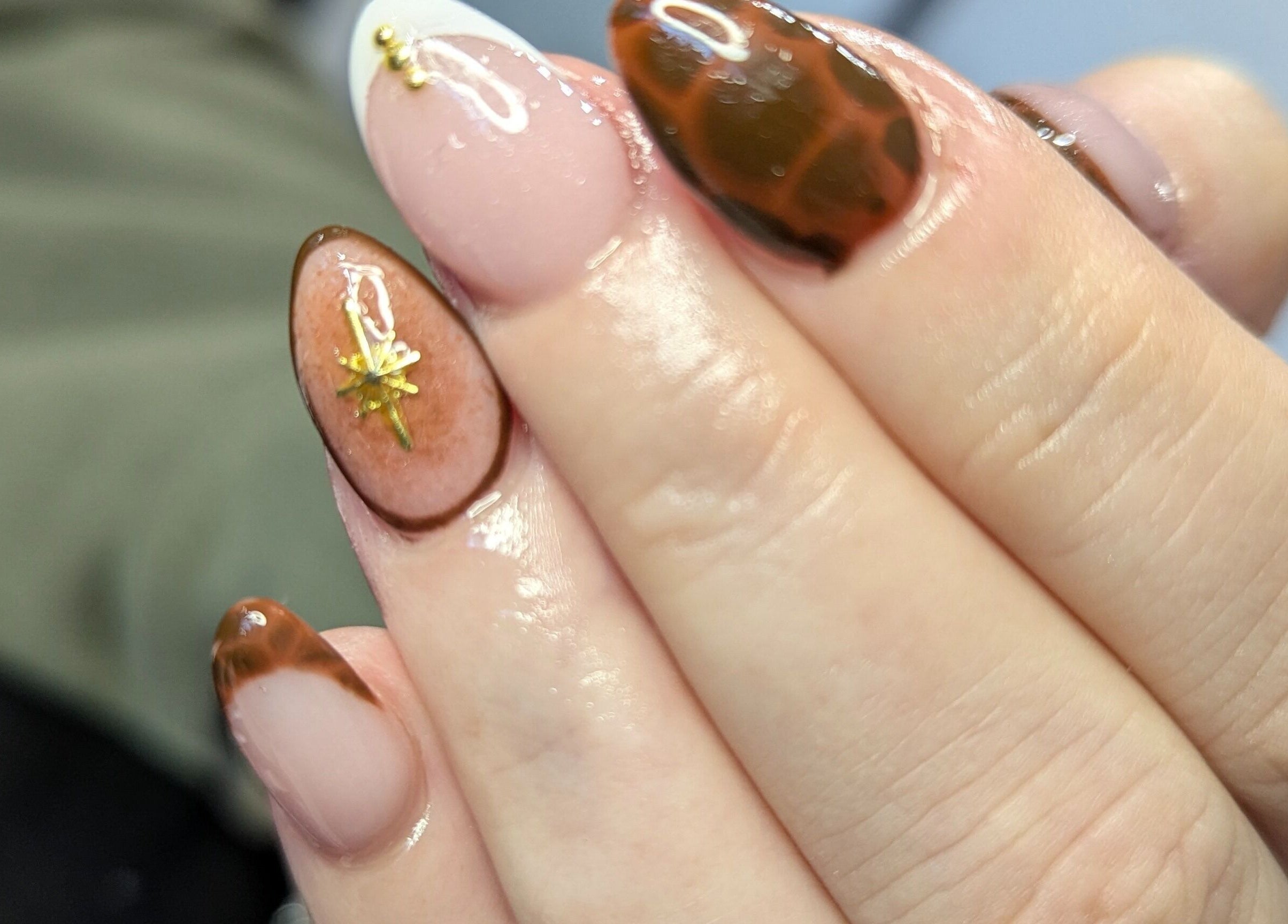 Elegant nail art at Kathsklaws in Wolverhampton, England, GB, showcasing intricate designs and glossy finish.