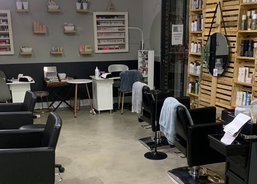 Polished Pixie Hair Design salon chairs and mirrors in Benoni, Gauteng, ZA offer a stylish setting.