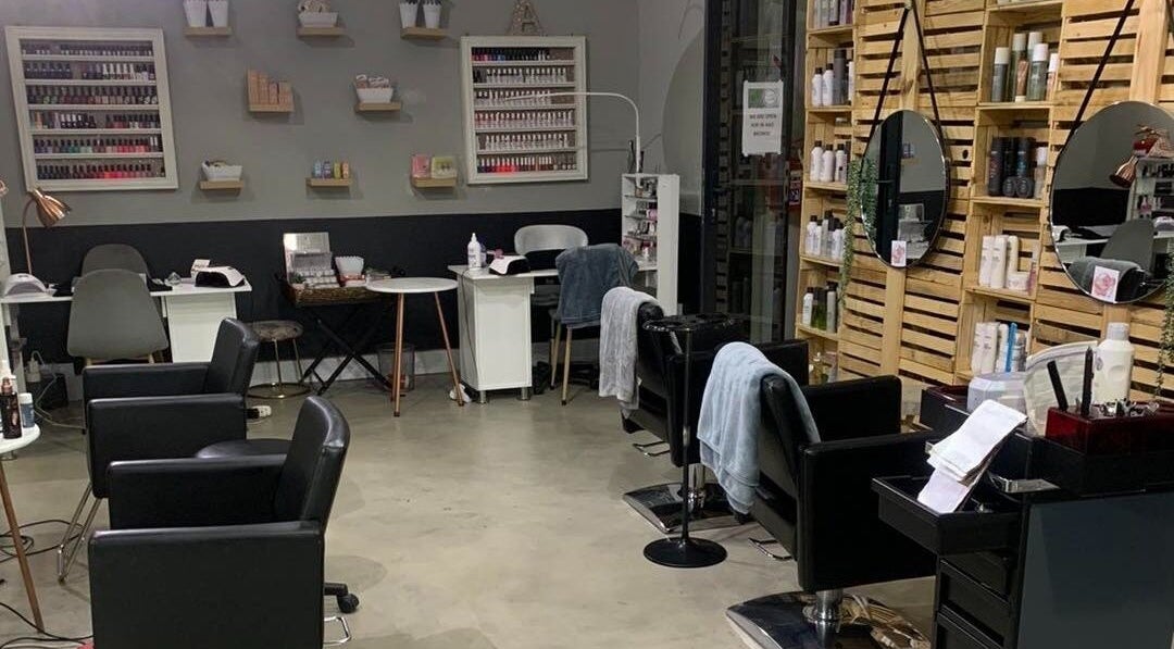 Polished Pixie Hair Design salon chairs and mirrors in Benoni, Gauteng, ZA offer a stylish setting.