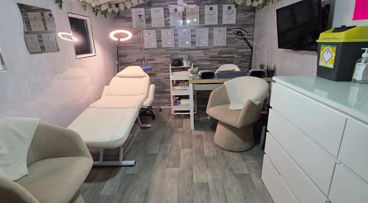Elegant treatment room at Aesthetics by Wendy, Belfast, Northern Ireland, GB showcasing modern furniture and decor.
