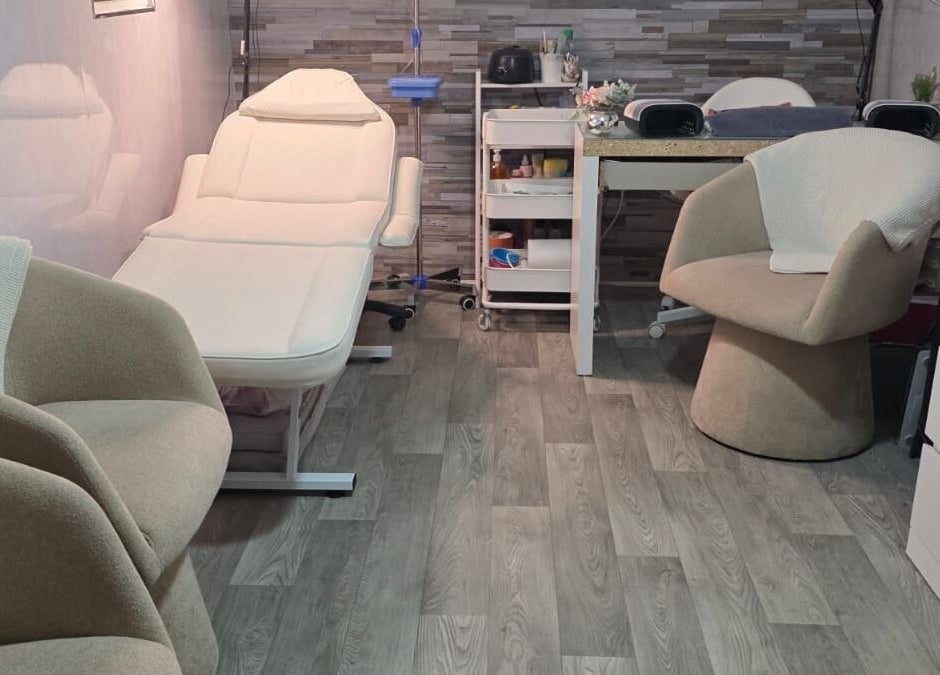 Cozy treatment room at Aesthetics by Wendy, Belfast, Northern Ireland, GB featuring elegant furnishings.