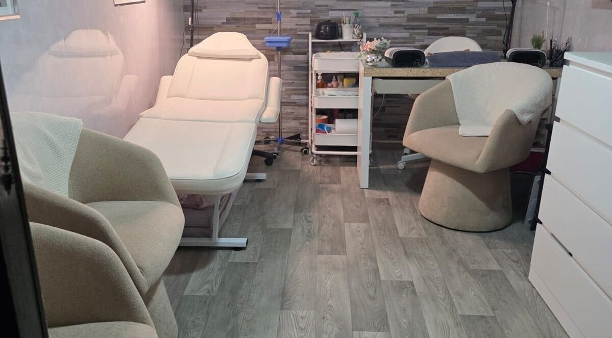Cozy treatment room at Aesthetics by Wendy, Belfast, Northern Ireland, GB featuring elegant furnishings.