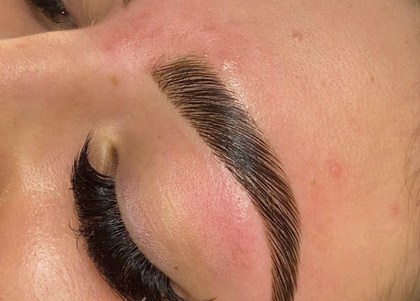 Perfectly groomed eyebrow and eyelash enhancement at TAMED by Emily Taylor, St Leonards, New South Wales, AU.