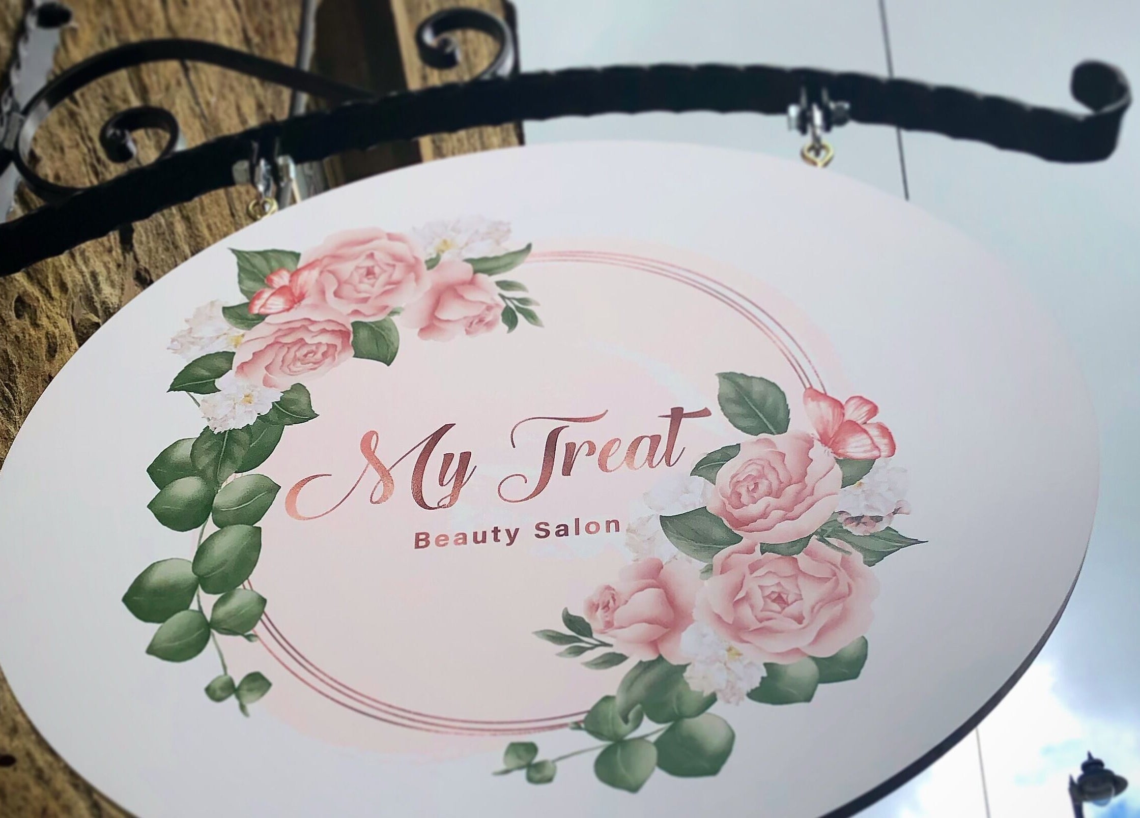 My Treat beauty salon sign with pink flowers in Ramsbottom, England, GB.