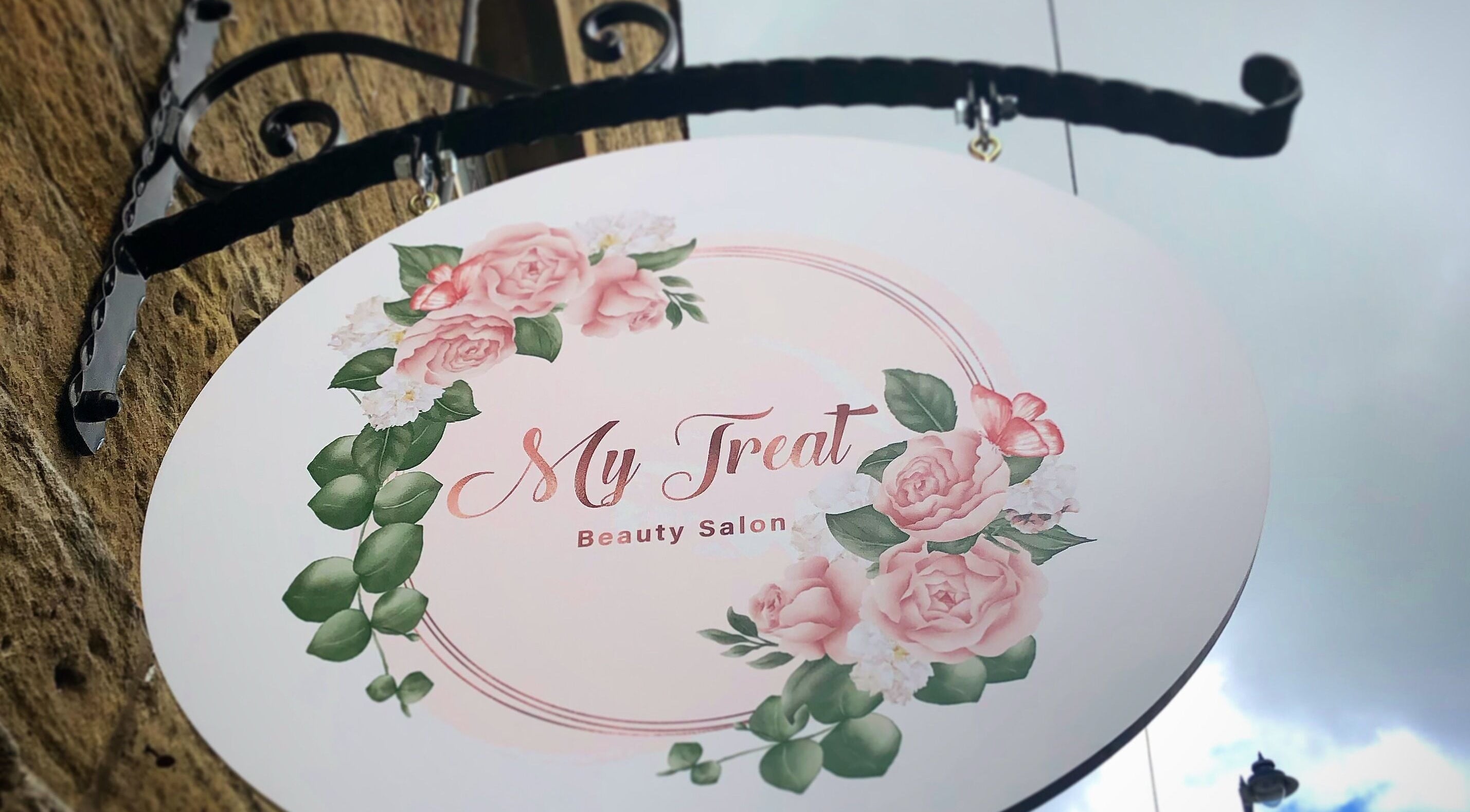 My Treat beauty salon sign with pink flowers in Ramsbottom, England, GB.