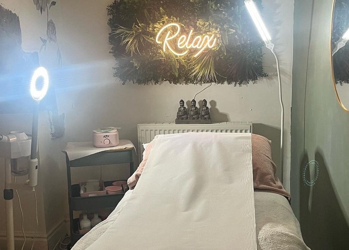 Relaxing therapy room at My Treat in Ramsbottom, England, GB with a cozy treatment bed and ambient lighting.