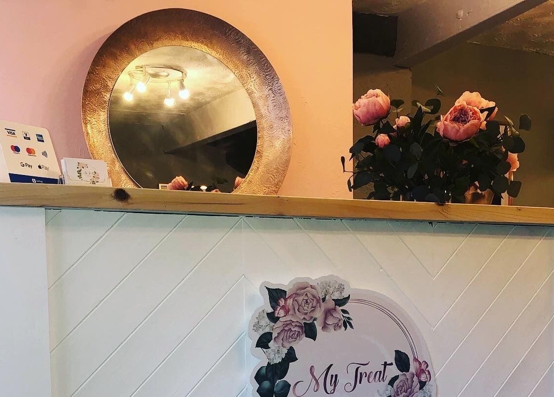 Elegant reception desk with floral decor at My Treat, Ramsbottom, England, GB.