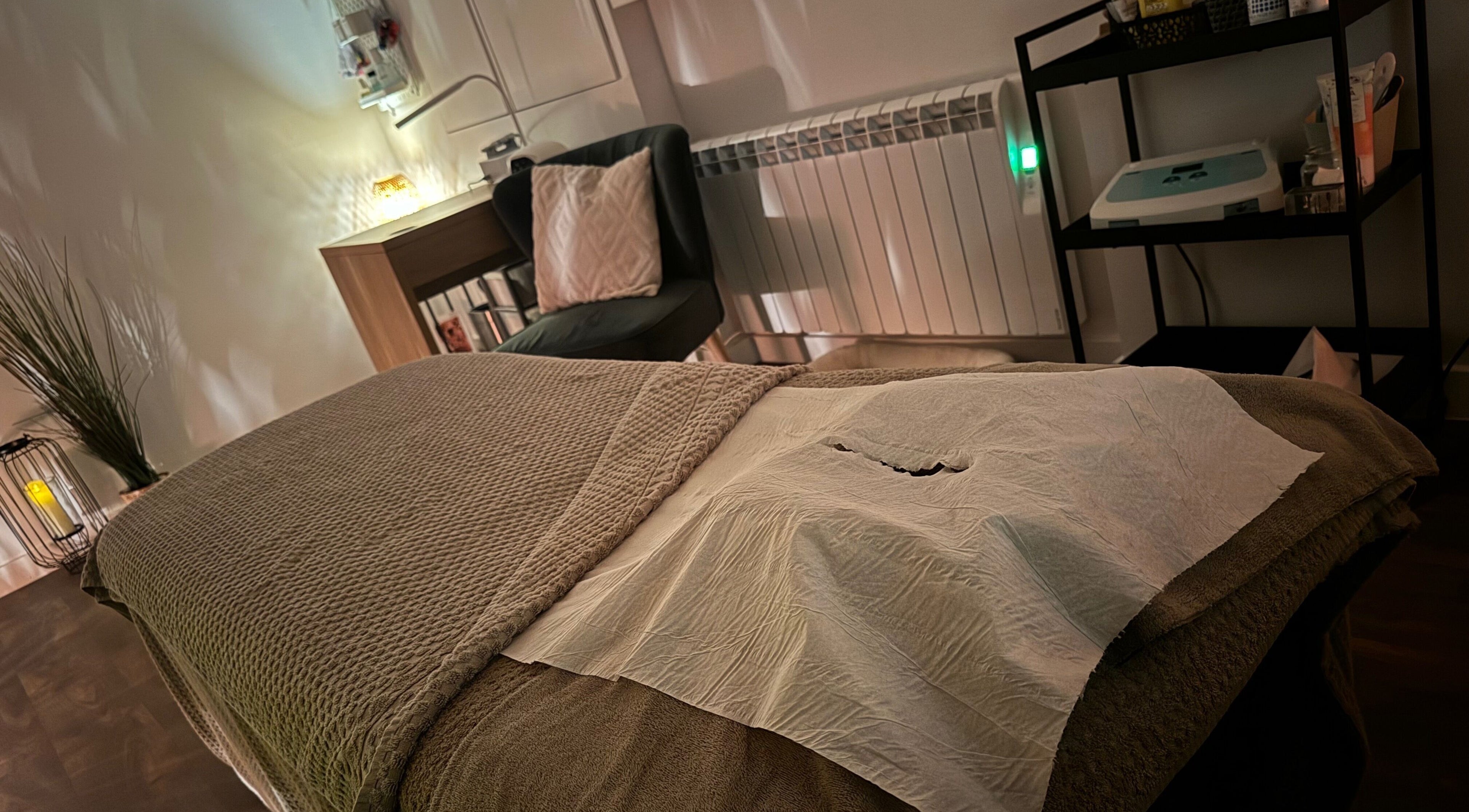 Cozy treatment room at Samantha Joyce Beauty, Basingstoke, England, GB, with massage bed and ambient lighting.