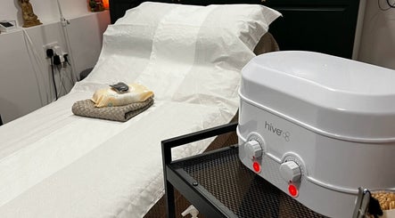 Relaxing treatment room at Samantha Joyce Beauty, Basingstoke, England, GB, featuring a comfortable spa bed.