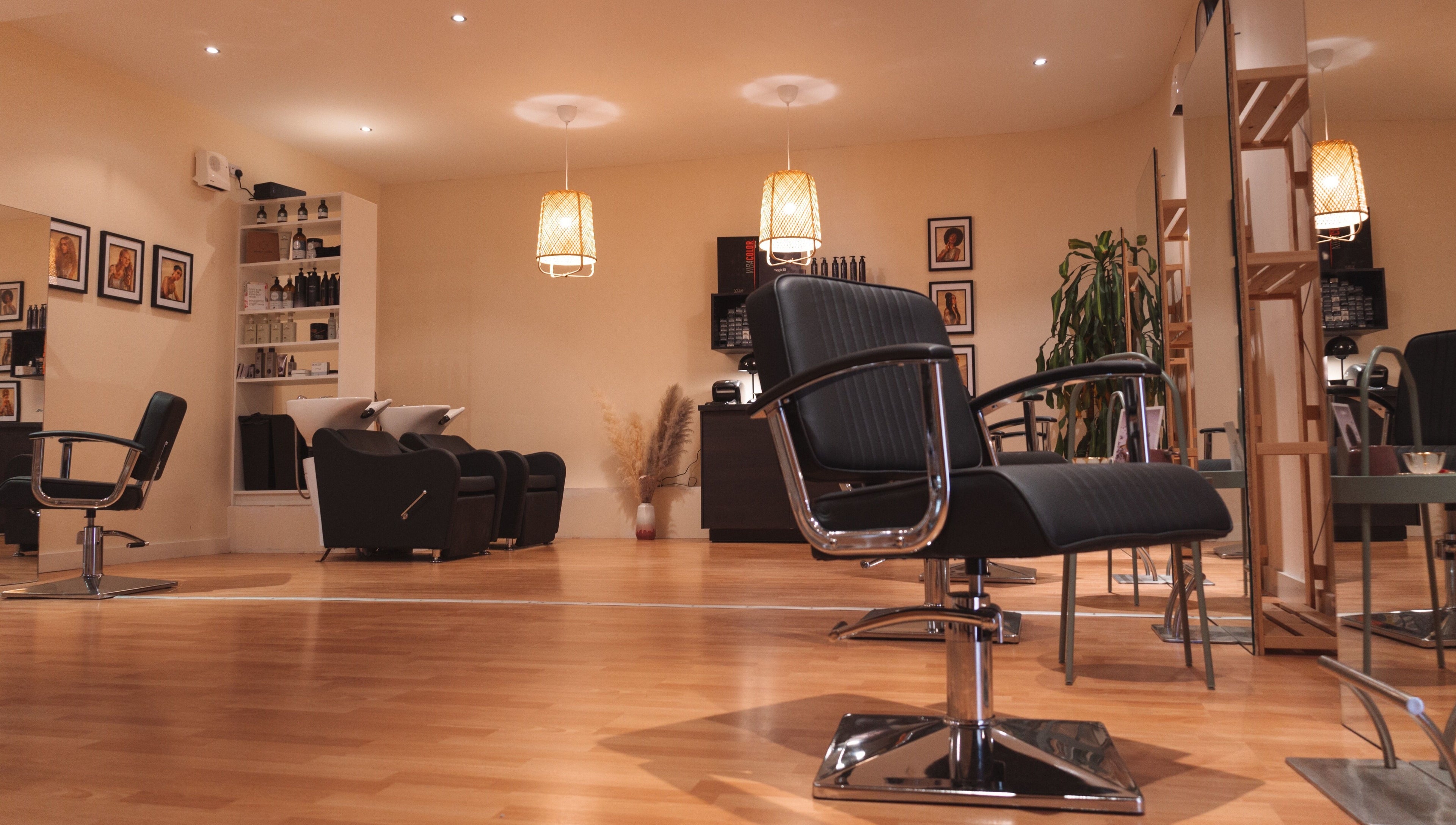 Elegant salon interior at La Bohème Hub, Lisburn, Northern Ireland, GB featuring chic styling chairs and ambient lighting.
