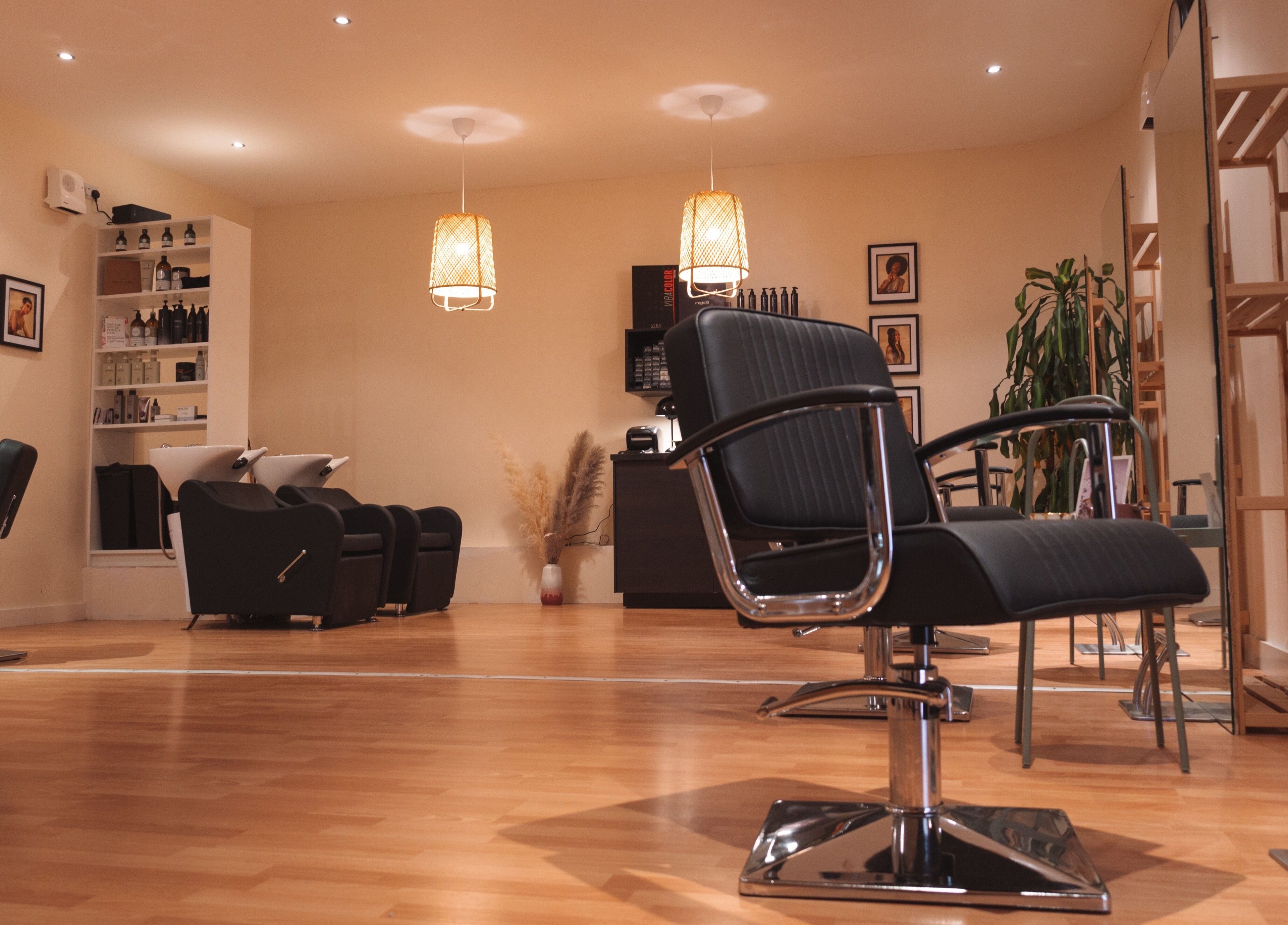 Elegant salon interior at La Bohème Hub, Lisburn, Northern Ireland, GB featuring chic styling chairs and ambient lighting.