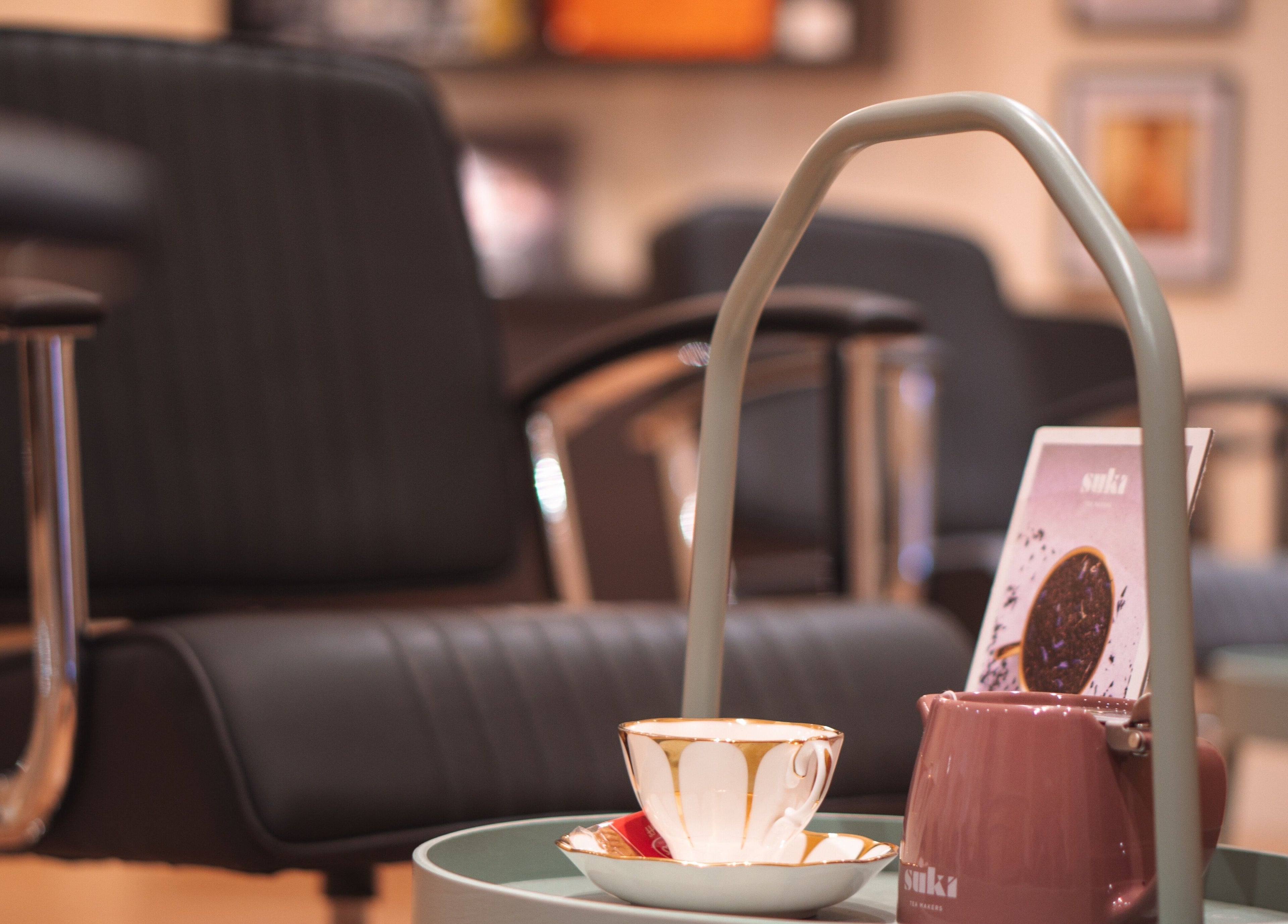 Relaxing tea setup in La Bohème Hub, Lisburn, Northern Ireland, GB. Elegant seating and calming ambiance.
