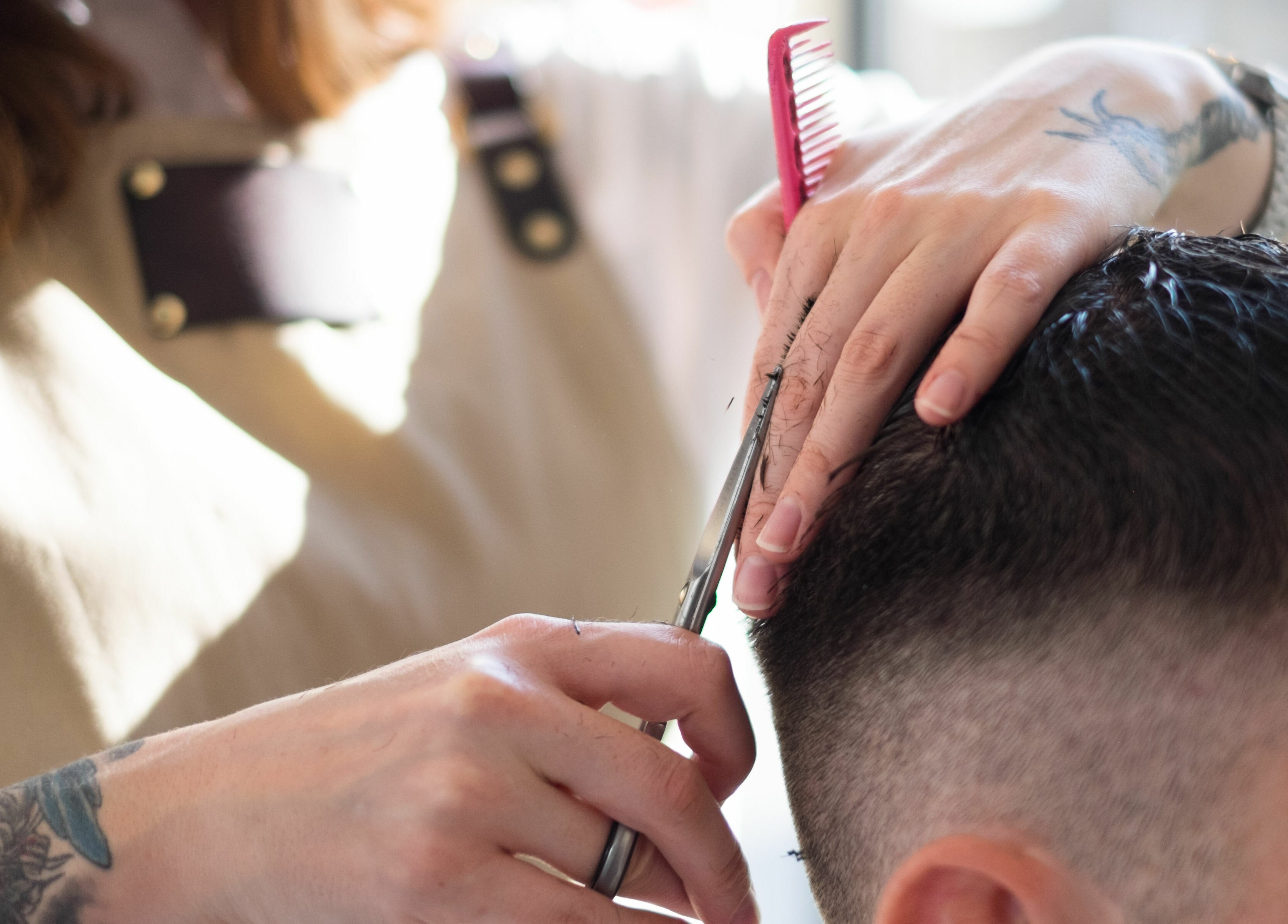 Haircut in progress at ELP Barbershop, London, England, GB, showcasing skilled barber technique and precision.