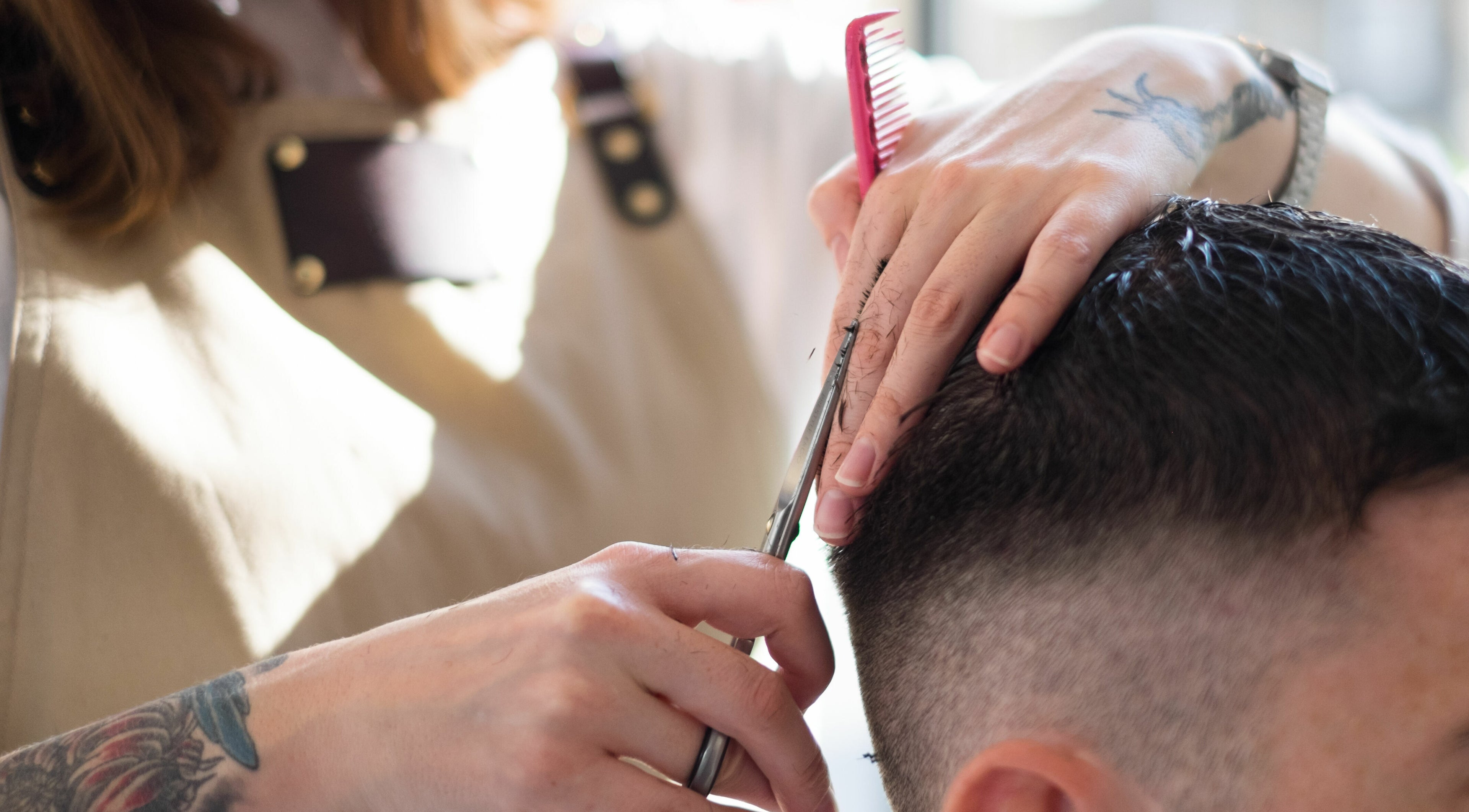 Haircut in progress at ELP Barbershop, London, England, GB, showcasing skilled barber technique and precision.