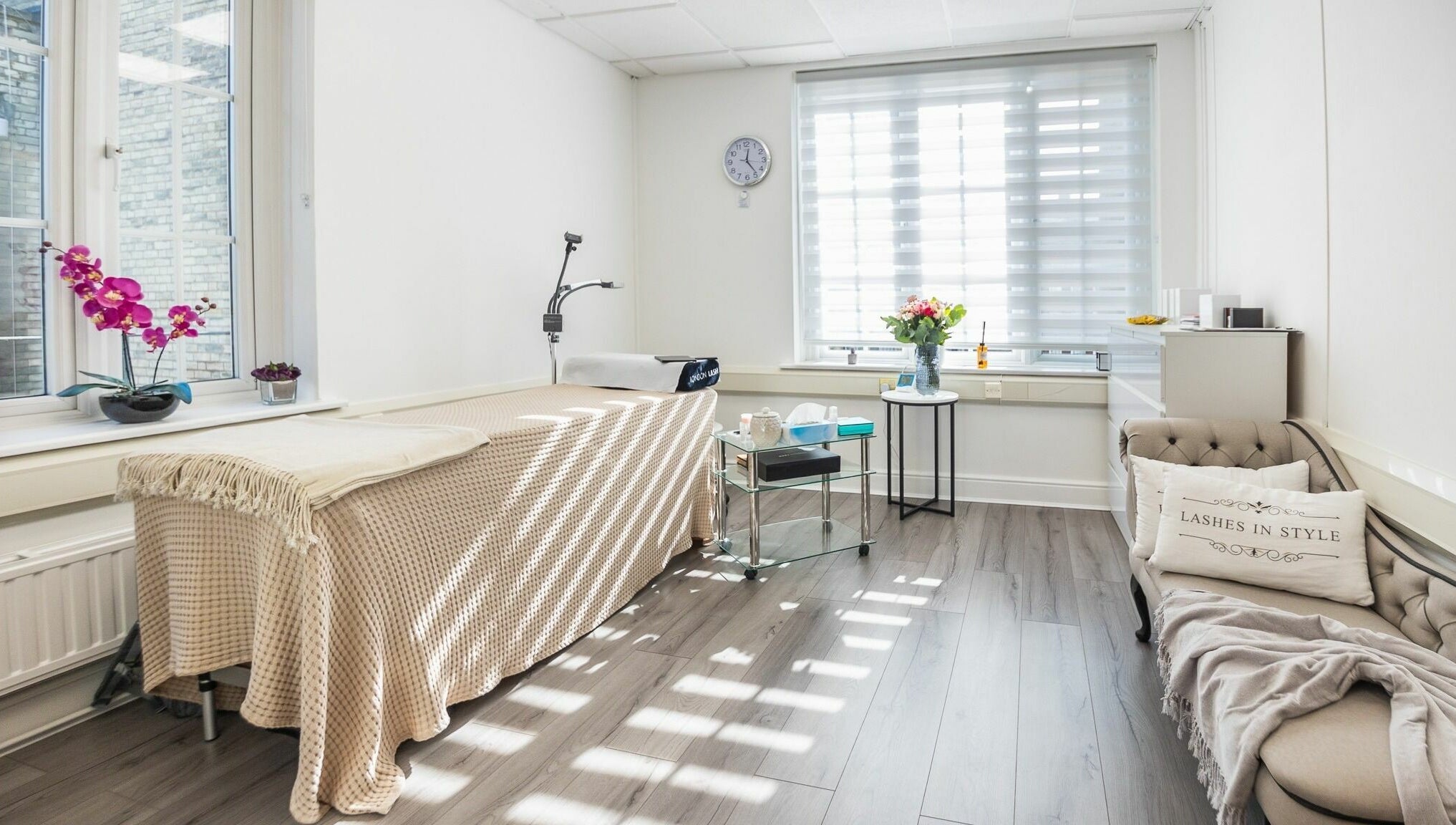 Sunny, elegant room at Lashes In Style, London, England, GB, with a cozy treatment bed and welcoming decor.