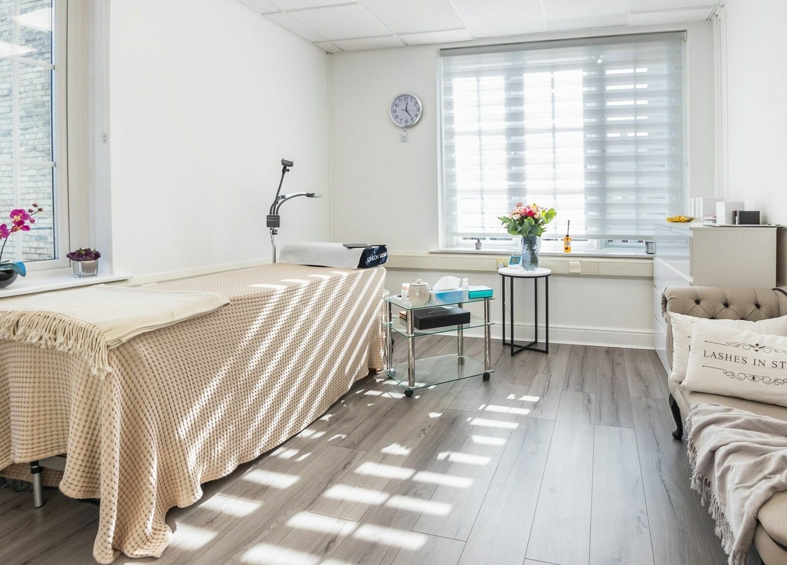 Sunny, elegant room at Lashes In Style, London, England, GB, with a cozy treatment bed and welcoming decor.