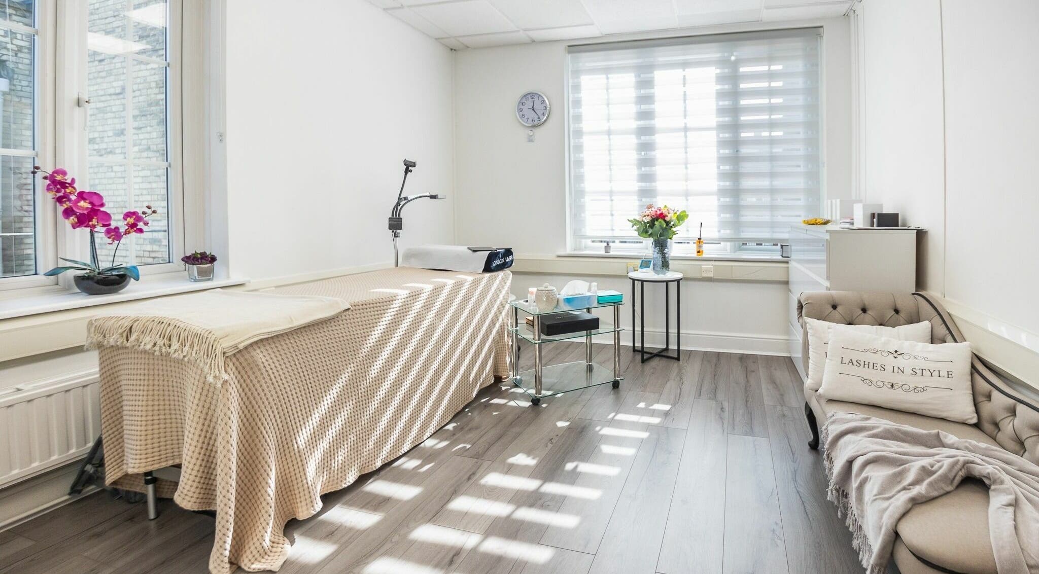 Sunny, elegant room at Lashes In Style, London, England, GB, with a cozy treatment bed and welcoming decor.